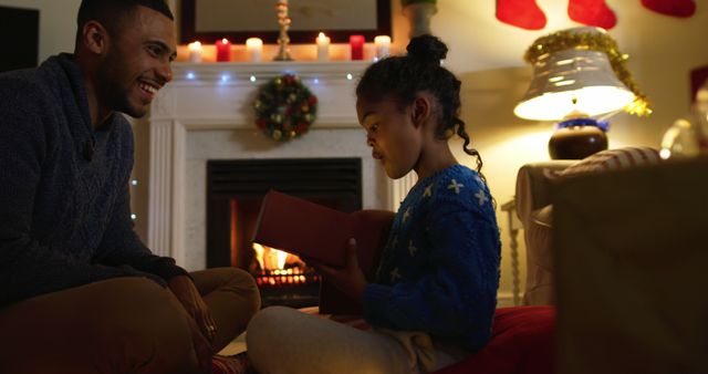 Father and Daughter Sharing Cozy Christmas Moment by Fireplace - Download Free Stock Images Pikwizard.com