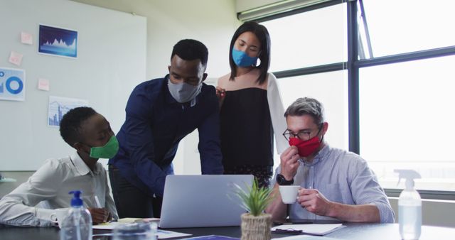 Diverse Team Collaborating in Office with Face Masks - Download Free Stock Images Pikwizard.com