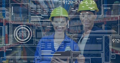 Two women checking tablet with industrial analytics overlays in warehouse aisle