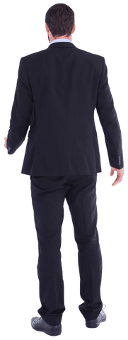 Rear view of businessman standing in a black suit, suitable for business presentations or corporate articles. Transparent background allows easy integration in marketing materials or website designs focusing on professionalism.