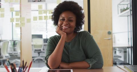 Confident African American Businesswoman Smiling in Creative Office - Download Free Stock Images Pikwizard.com