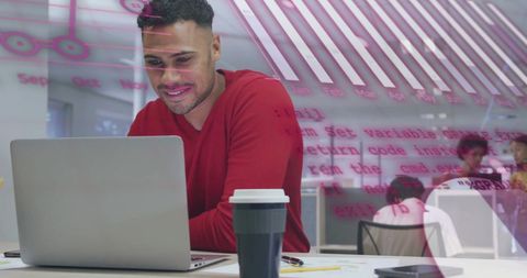 Business Professional Analyzing Data on Laptop with Code Overlay