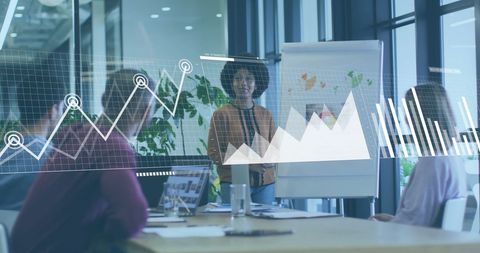 young professionals analyzing financial graphs in modern office - Download Free Stock Images Pikwizard.com