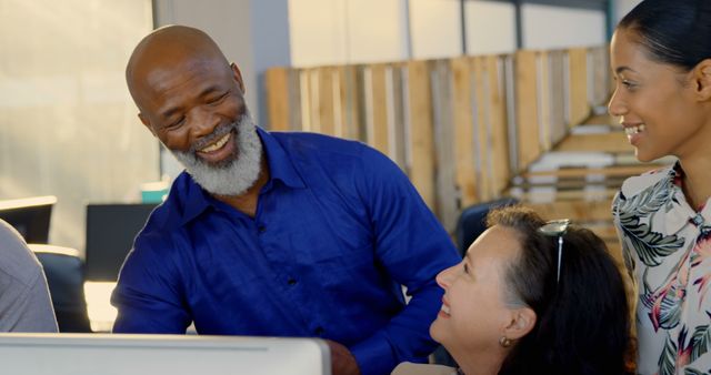 Diverse Business Team Smiling and Collaborating in Modern Office - Download Free Stock Images Pikwizard.com