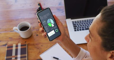 Businesswoman Analyzing Statistics on Smartphone and Laptop - Download Free Stock Images Pikwizard.com