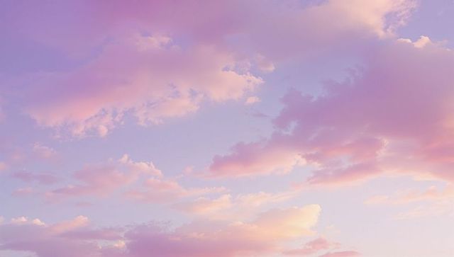Pastel clouds against serene sunset sky