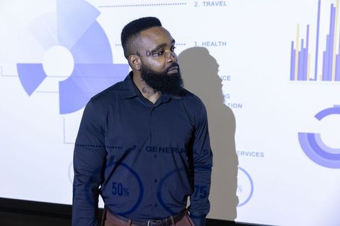 Professional Businessman Analyzing Data Charts in Conference Room