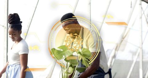 Greenhouse team inspecting potted plants with augmented reality overlays for smart horticulture