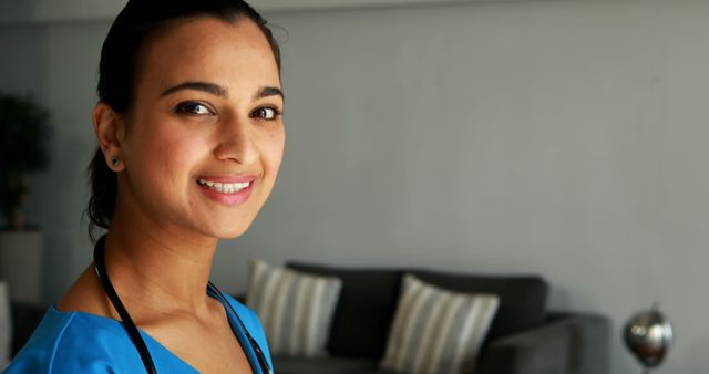 Smiling Nurse in Blue Scrubs Indoors - Download Free Stock Images Pikwizard.com