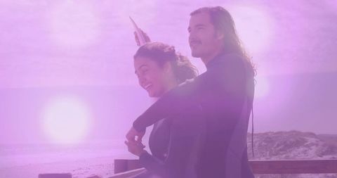 Couple Embracing and Taking Selfie at Beach Sunset