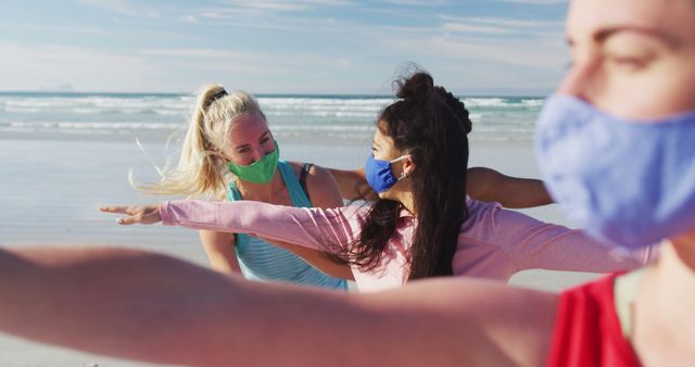 Group Yoga Session on Beach while Wearing Masks - Download Free Stock Images Pikwizard.com