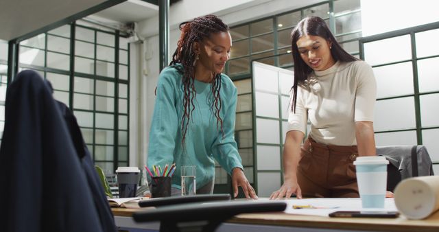 Two Women Collaborating in Modern Office Workspace - Download Free Stock Images Pikwizard.com