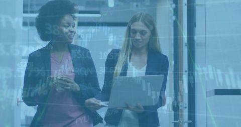 Diverse Business Colleagues Analyzing Financial Data on Laptop