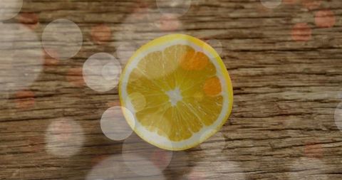 Lemon Slice on Wooden Surface with Bokeh Lights - Download Free Stock Images Pikwizard.com
