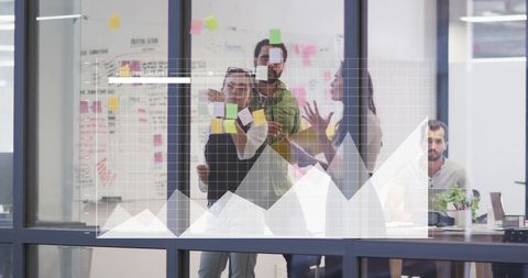 Diverse Team Collaborating in Modern Office with Infographics