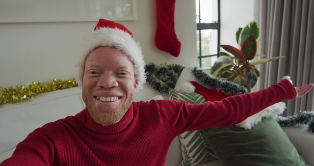 Man with Santa Hat Celebrating Christmas at Home - Download Free Stock Images Pikwizard.com