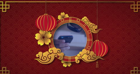 Hand Holding Smartphone with Chinese New Year Graphic Overlay