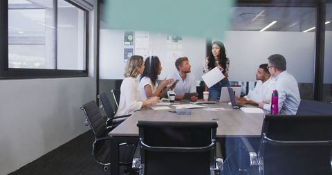Diverse Team in Active Business Meeting at Modern Office