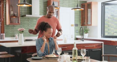 Couple Enjoying Romantic Dinner Together in Modern Kitchen