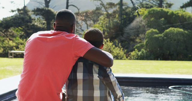 Father and Son Bonding by Pond in Sunny Nature Setting - Download Free Stock Images Pikwizard.com