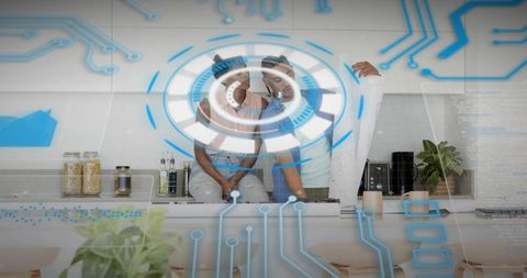 Couple exploring augmented reality home design using holographic interface in kitchen