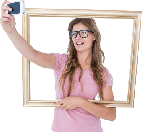 Smiling blonde woman taking selfie in transparent frame