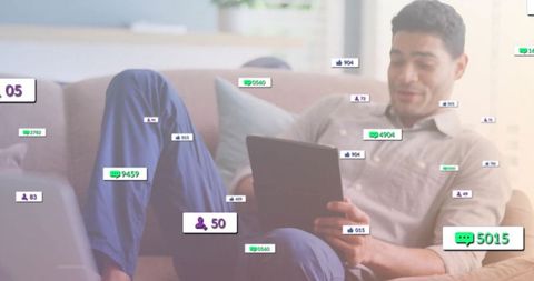 Man Relaxing on Sofa Using Tablet with Floating Social Metrics