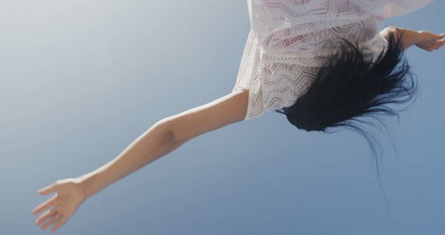 Woman experiencing freedom and joy under clear blue sky - Download Free Stock Images Pikwizard.com