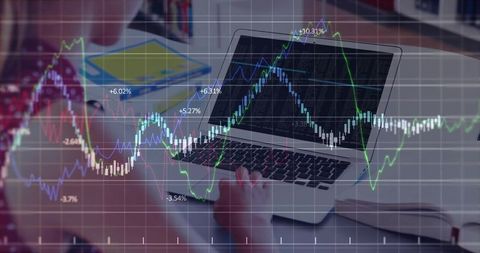 Teen student analyzing stock market graphs on laptop at home