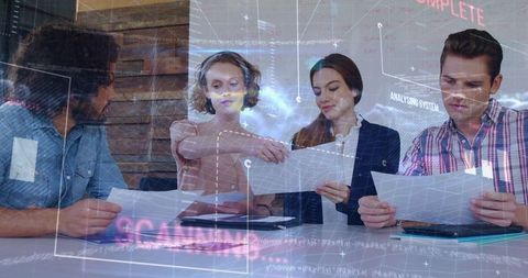 Business Team Analyzing Data Documents in Modern Office