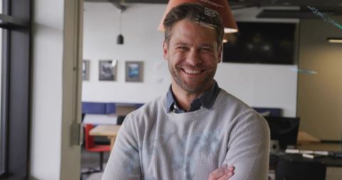 Confident professional male in modern coworking space