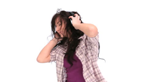 Woman Joyfully Dancing with Headphones on