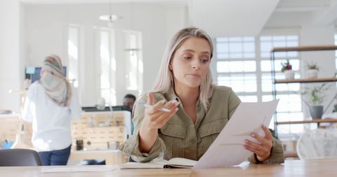 Businesswoman Conducting Video Call in Modern Office Setting - Download Free Stock Images Pikwizard.com