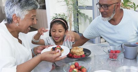 Family Breakfast Bonding Over Pancakes and Berries