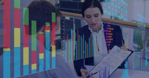 Business professionals reviewing financial reports with holographic analytics overlay