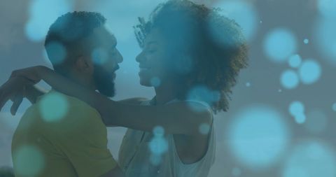 Joyful Couple Embracing by Seaside with Dreamy Light Effects