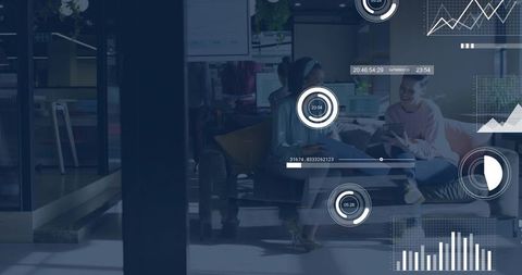 Creative team collaborating in modern office lounge with HUD data overlays and tablet