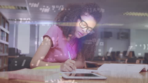 Focused Businesswoman Analyzing Data and Taking Notes in Office