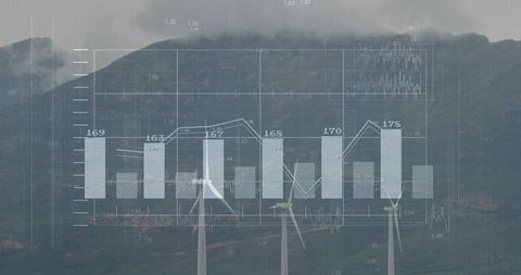 Wind farm data visualization over misty mountain ridge showing turbine performance metrics