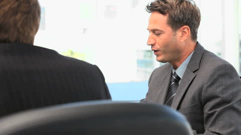 Businessman Having Discussion in Office Meeting