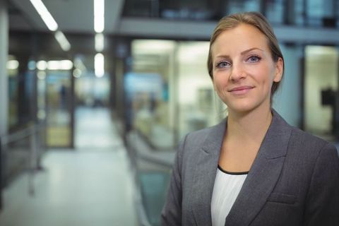 Confident Professional Woman in Modern Corporate Office