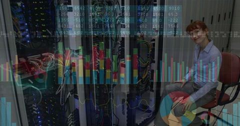Engineer Analyzing Data Center Operations with Digital Charts