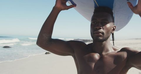 Athletic Surfer Holding Surfboard at Sandy Beach - Download Free Stock Images Pikwizard.com