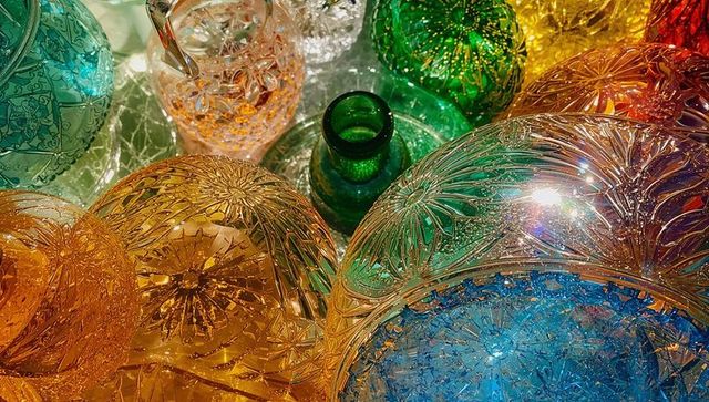 Vibrant colorful cut glass orbs in elegant display