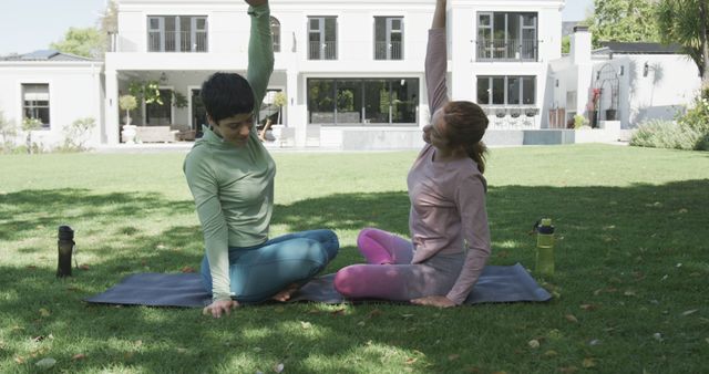 Women Exercising Outdoors on Yoga Mats in Sunlit Garden - Download Free Stock Images Pikwizard.com
