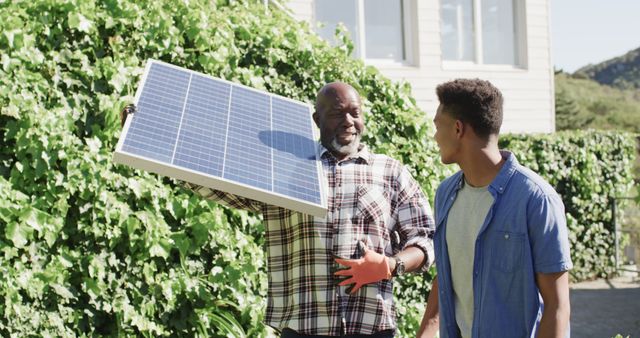 Older Man and Young Man Installing Solar Panel Outdoors - Download Free Stock Images Pikwizard.com