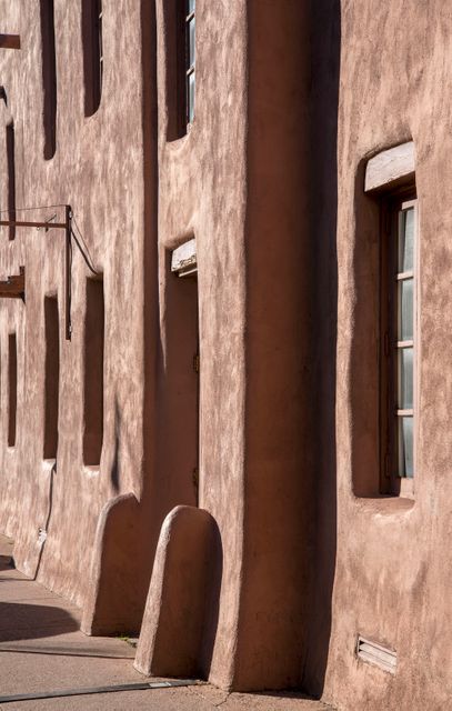 Close-up of Adobe Building Exterior With Textured Wall and Rustic Windows - Download Free Stock Images Pikwizard.com