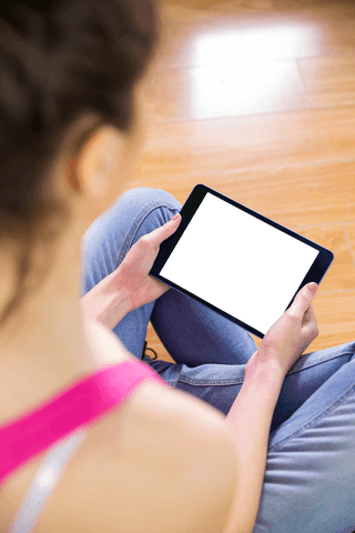 Transparent Tablet Screen Woman Sitting on Floor Using Device