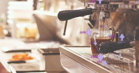 Espresso shot precision brewing with digital data in modern cafe