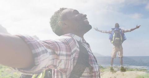 Joyful Man Embracing Adventure near Ocean